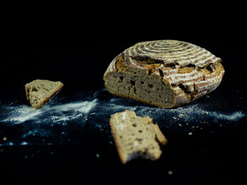 Close-up of bread on black background