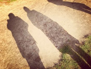 Shadow of people on grass