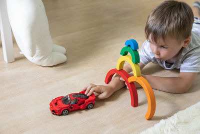 Portrait of boy playing with toy on table