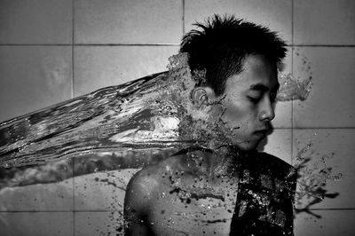 Young man in bathroom