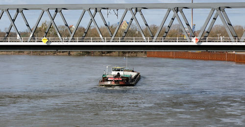 Boat on bridge over river