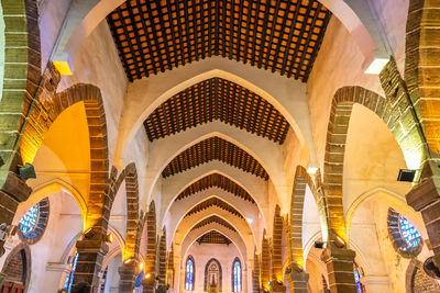 Low angle view of illuminated ceiling of building