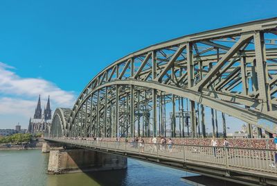 Bridge over river against blue sky