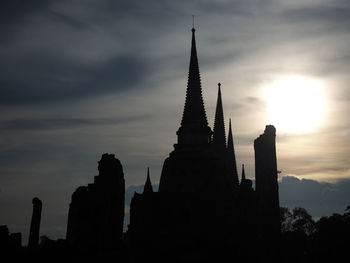 Low angle view of silhouette building against sky during sunset