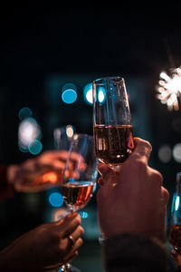 Close-up of hand holding wine glass