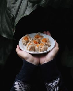 Midsection of woman having food