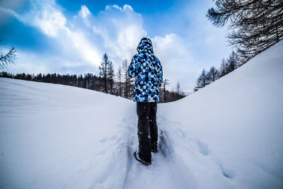Scenic view of snow covered landscape against sky