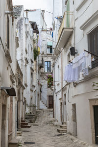 Narrow alley amidst buildings in town