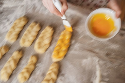 High angle view of person preparing food on table