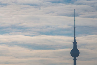 Fernsehturm against cloudy sky