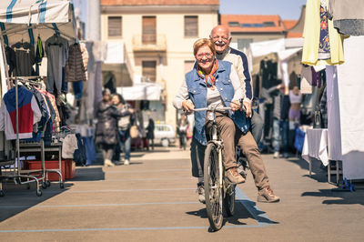 Man cycling on street in city