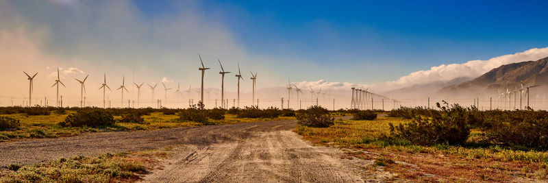 Panoramic view of road amidst land against sky