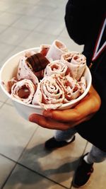 High angle view of hand holding ice cream