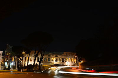 Light trails on road in city at night