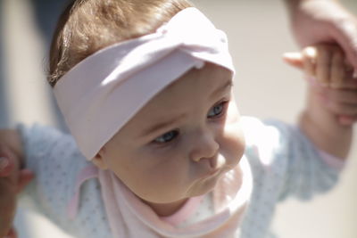 Close-up of mother carrying daughter at home