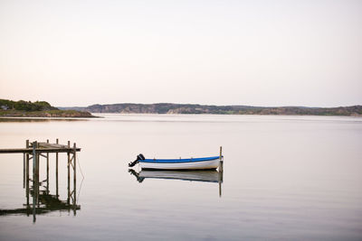 Motorboat moored in lake