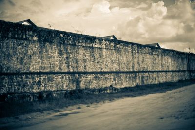 Built structure against cloudy sky