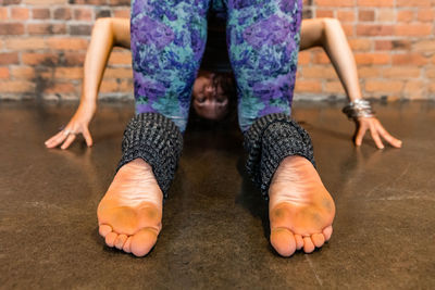 Low section of woman sitting on floor