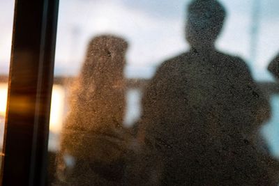 Shadow of people on glass window