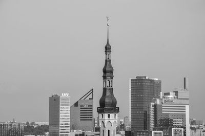 Modern buildings in city against clear sky