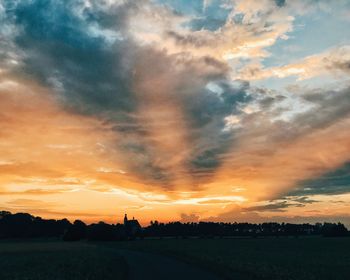 Silhouette of landscape against dramatic sky