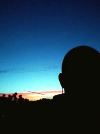 Silhouette trees against sky at sunset