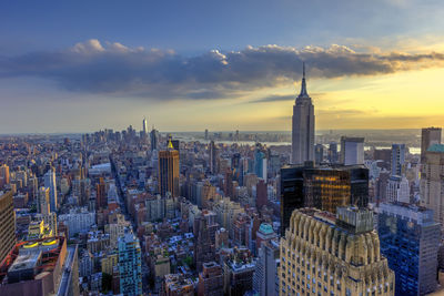 Aerial view of cityscape against sky during sunset