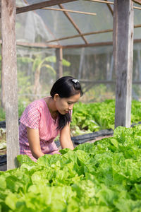 Woman looking at plants