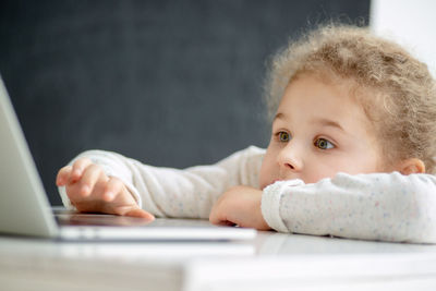 Portrait of cute girl using mobile phone