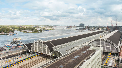 Rooftop view of amsterdam centraal train station and the river ij