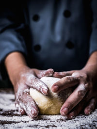 Midsection of man preparing food