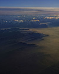 Aerial view of sea against sky during sunset