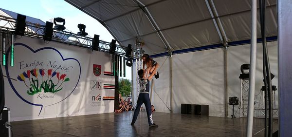 Rear view of man standing on wall