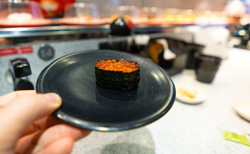 Close-up of person holding food