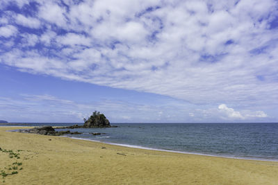 Scenic view of beach against sky