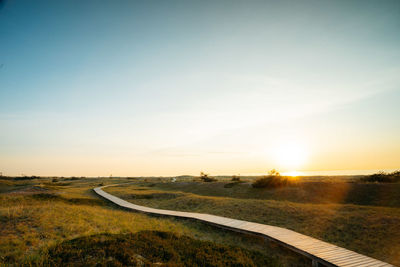 Scenic view of landscape against sky during sunset