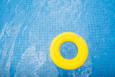 Yellow blue wall by swimming pool