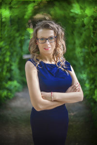 Portrait of smiling young woman standing outdoors