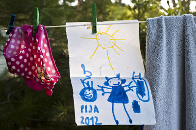 Close-up of clothes hanging on clothesline