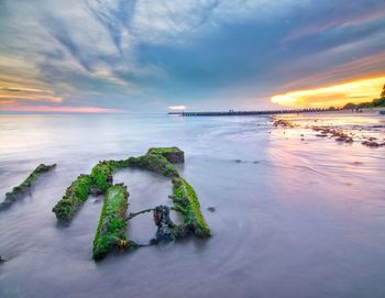 Scenic view of sea against sky during sunset