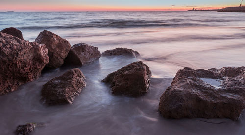 Scenic view of sea against sky during sunset