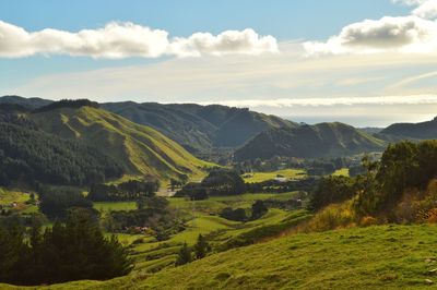 Scenic view of landscape and mountains against sky