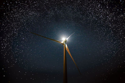 Low angle view of illuminated street light against sky at night