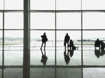 Silhouette people at airport