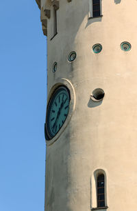 Low angle view of clock tower against sky