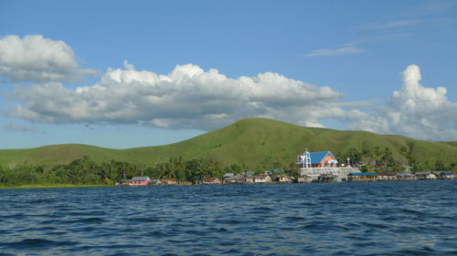 Scenic view of sea and buildings against sky