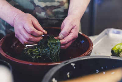 Midsection of man preparing food