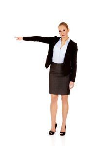 Portrait of young woman standing against white background
