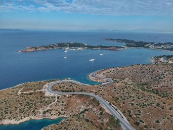 High angle view of sea and cityscape against sky