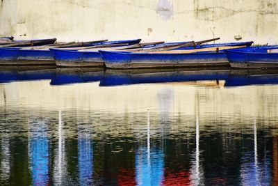 Boats moored in lake